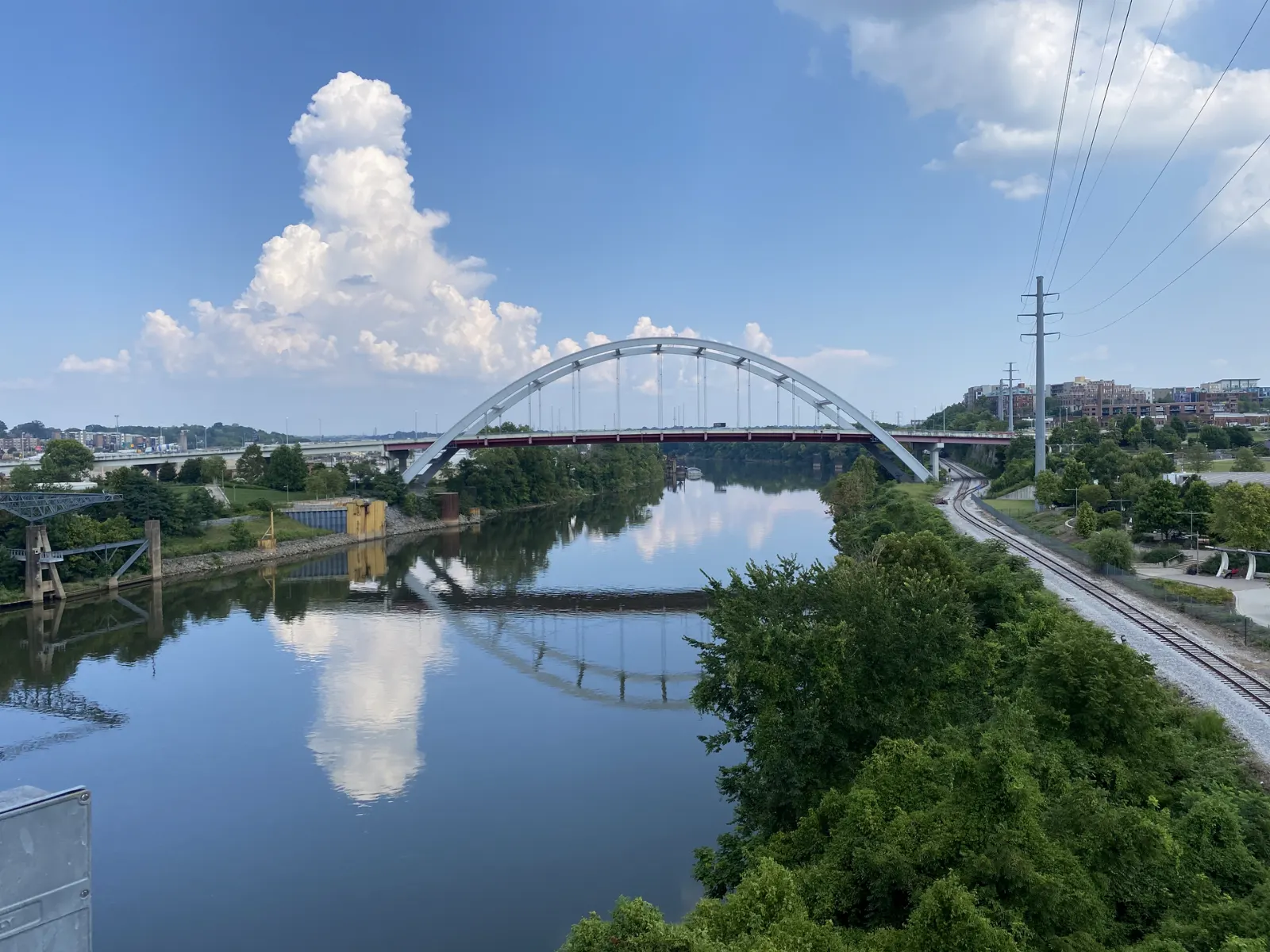 Steel truss pedestrian bridge crossing the Cumberland River toward downtown Nashville, Tennessee