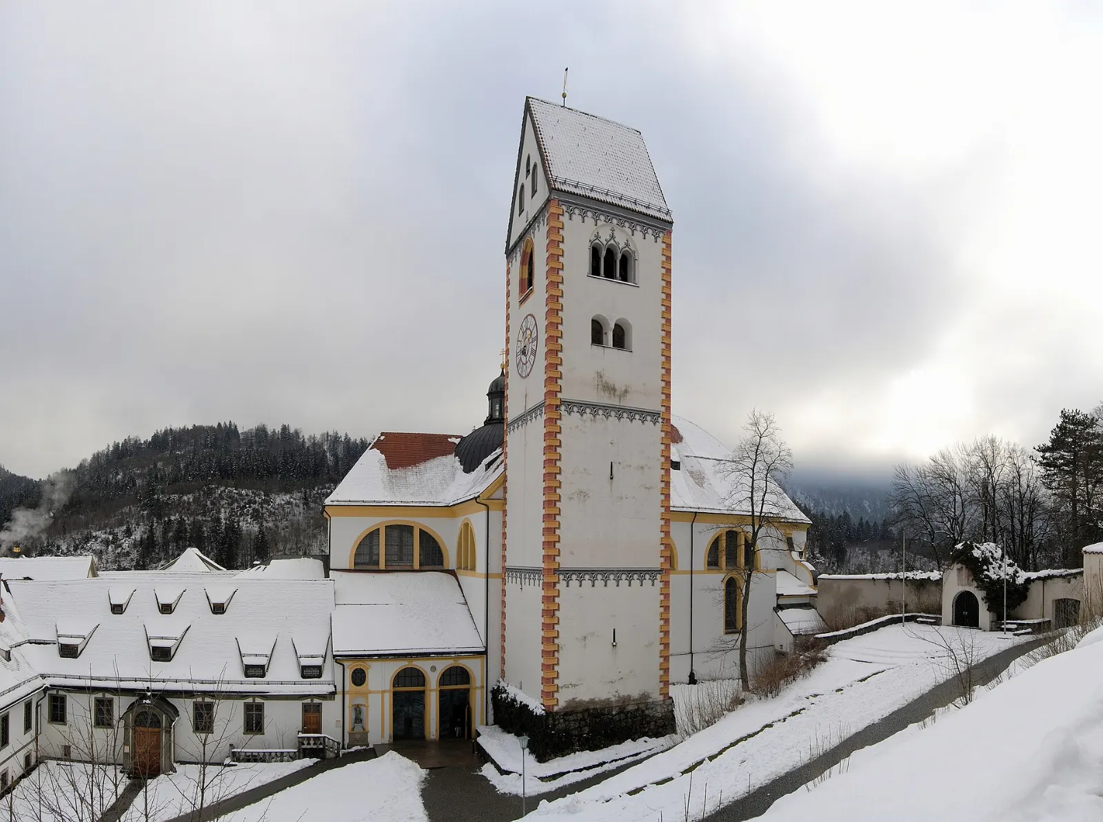 The Baroque church and former abbey of St. Mang beside the Lech river in Füssen, Neuschwanstein and Füssen, Germany