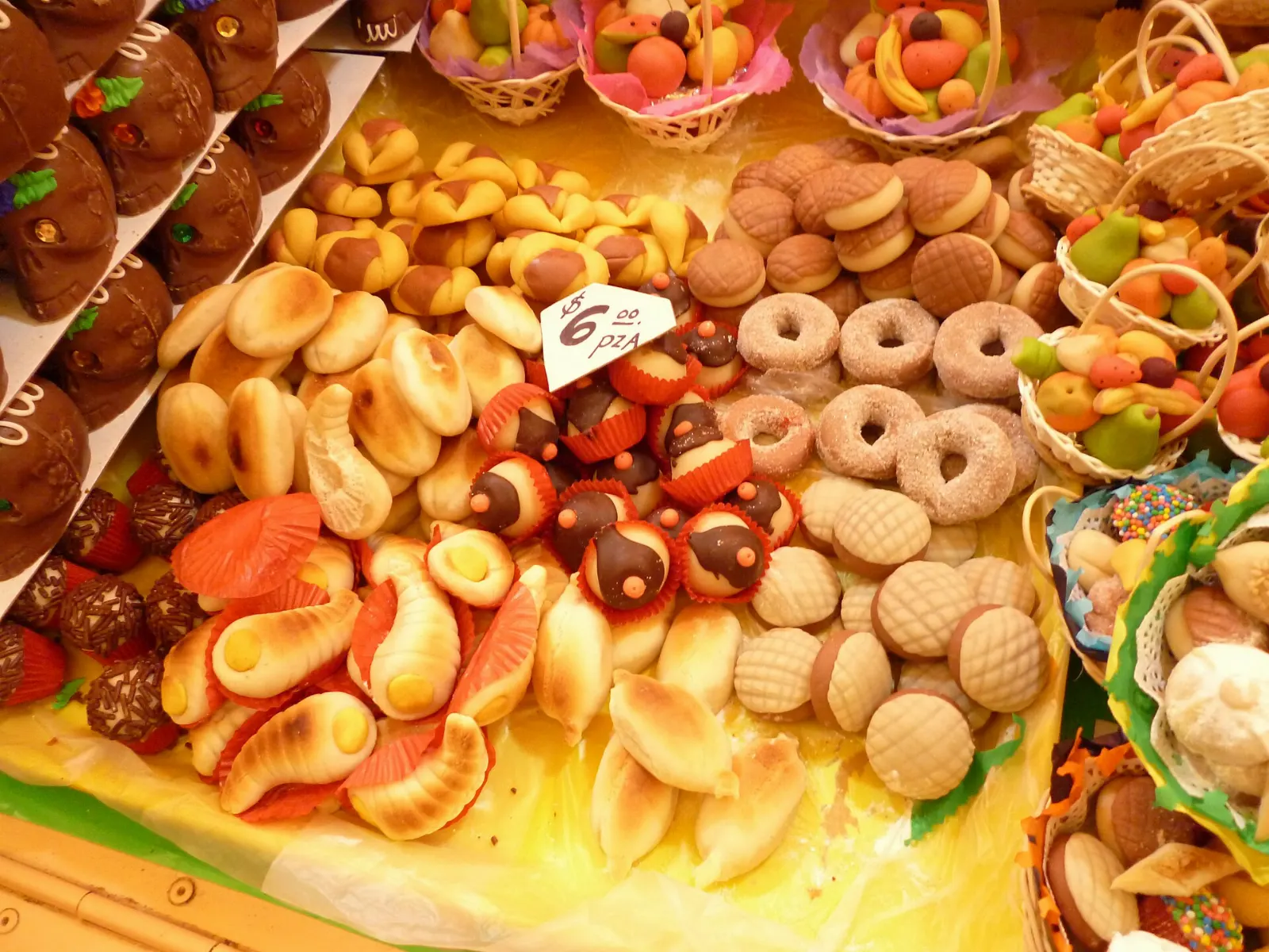 Colourful sugar figures called alfeñiques on a market stall, Nevado de Toluca, State of Mexico
