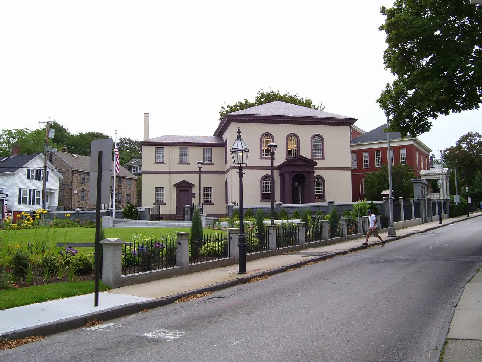 Brick exterior of Touro Synagogue behind its iron fence, Newport, Rhode Island