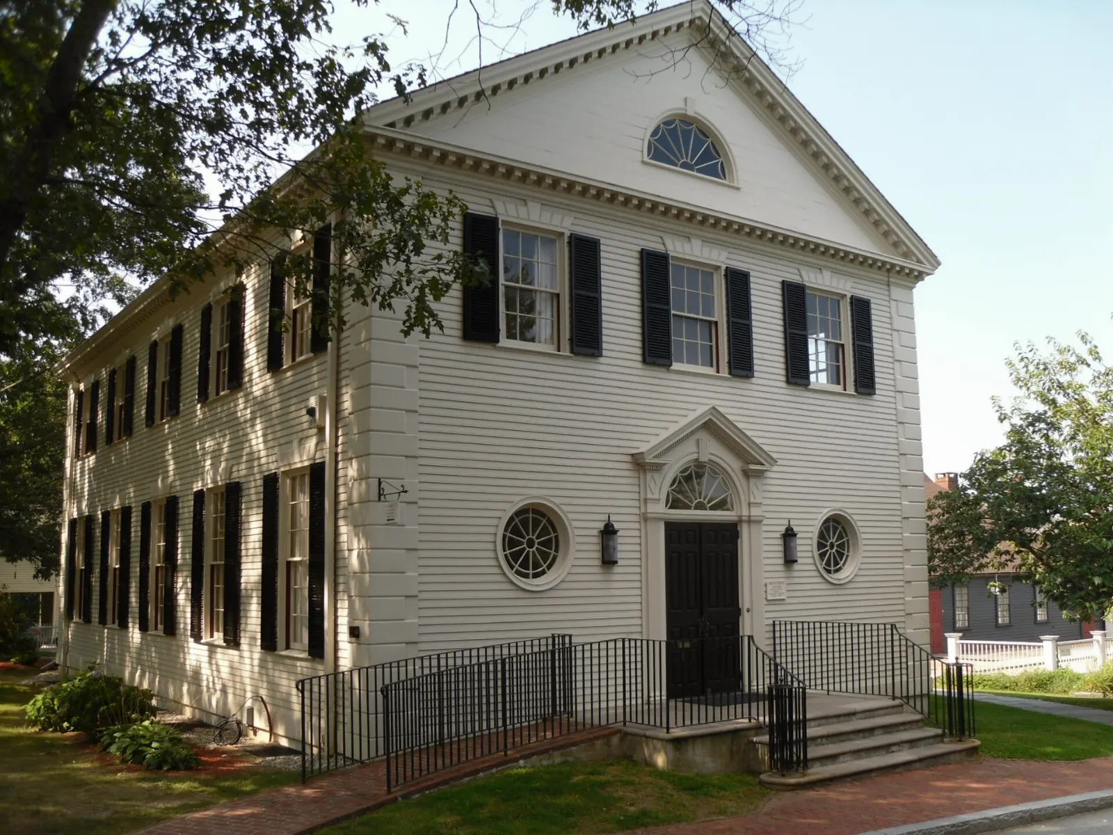 White wooden steeple of Trinity Church above Queen Anne Square, Newport, Rhode Island