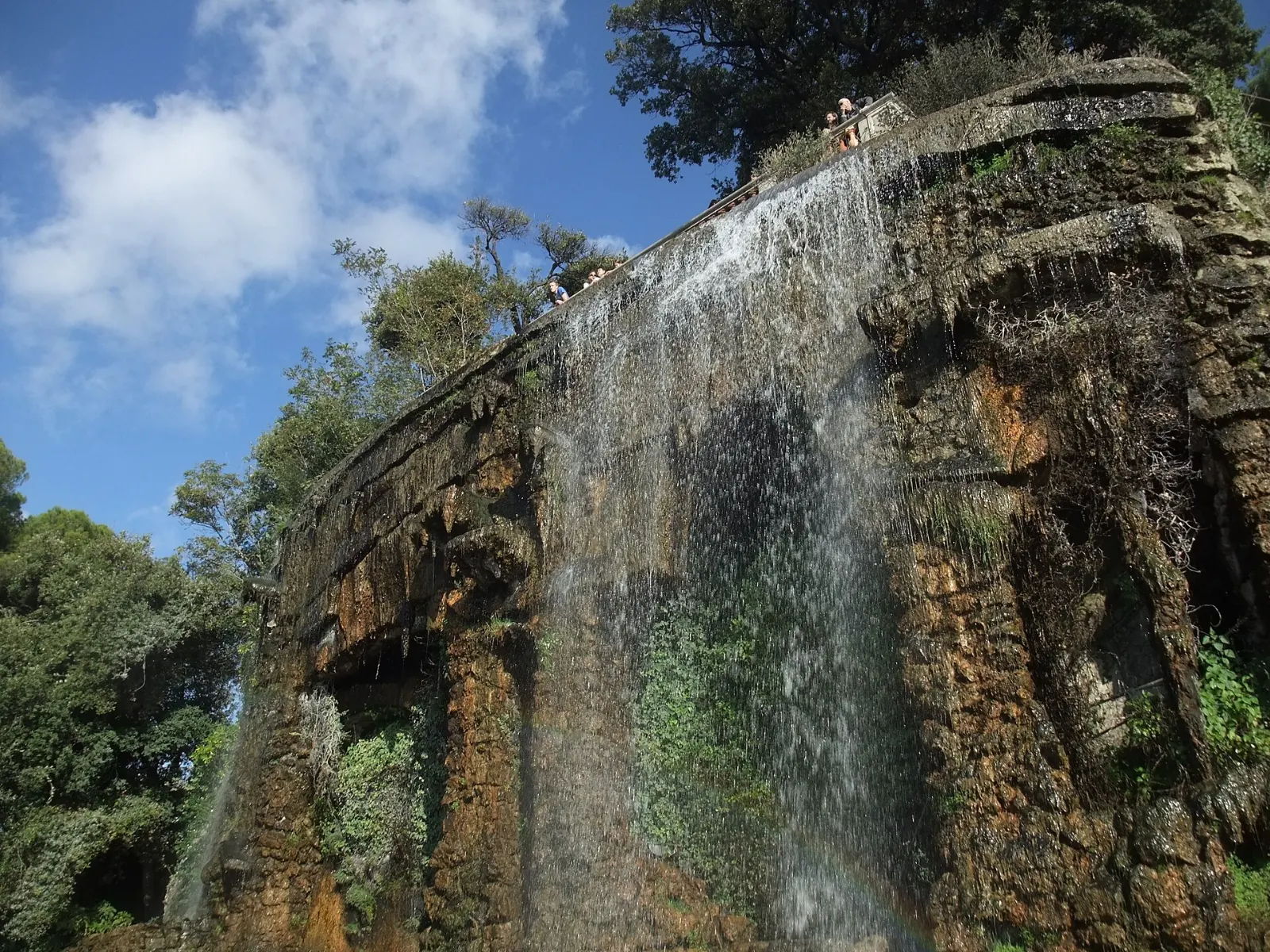 Artificial waterfall tumbling down a rocky slope in the Castle Hill park in Nice, Nice and the French Riviera, France