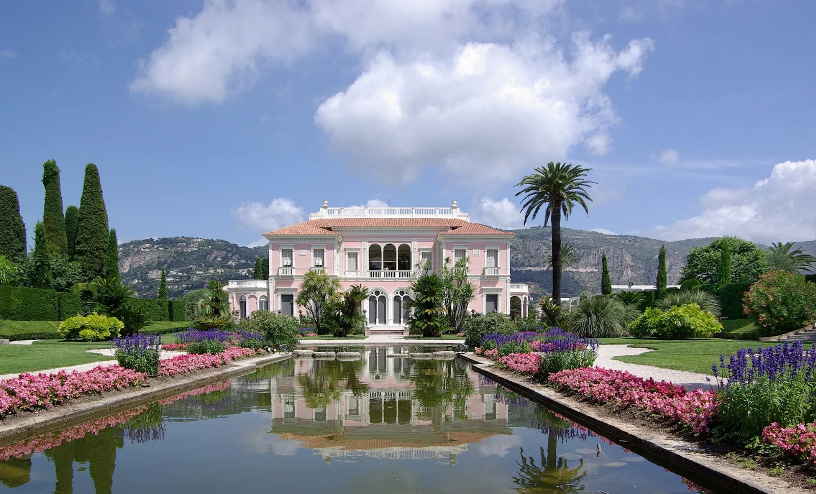 Pink Belle Epoque villa with formal French gardens and fountains on Cap Ferrat, Nice and the French Riviera, France