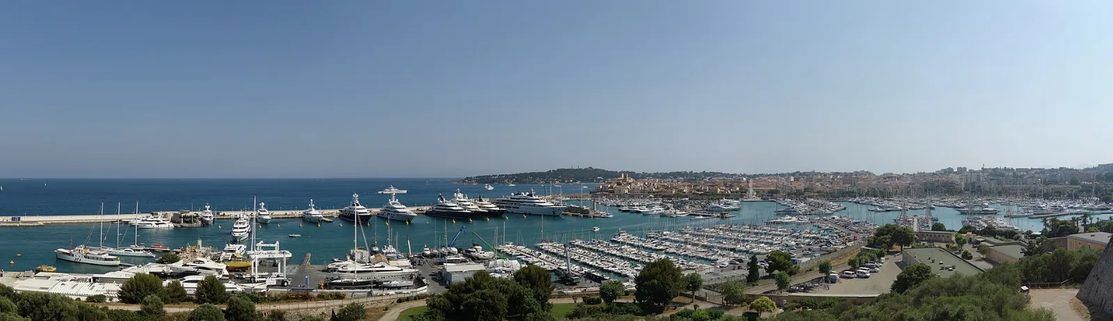 Yachts in Port Vauban with the ramparts of old Antibes and the Alps behind, Nice and the French Riviera, France