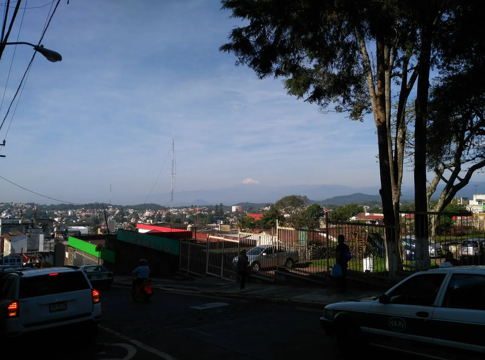 Snow capped Pico de Orizaba rising above green farmland, Veracruz