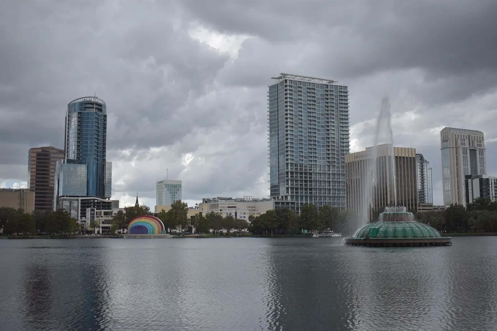The illuminated Linton E. Allen Memorial Fountain in Lake Eola with the downtown skyline, Orlando, Florida