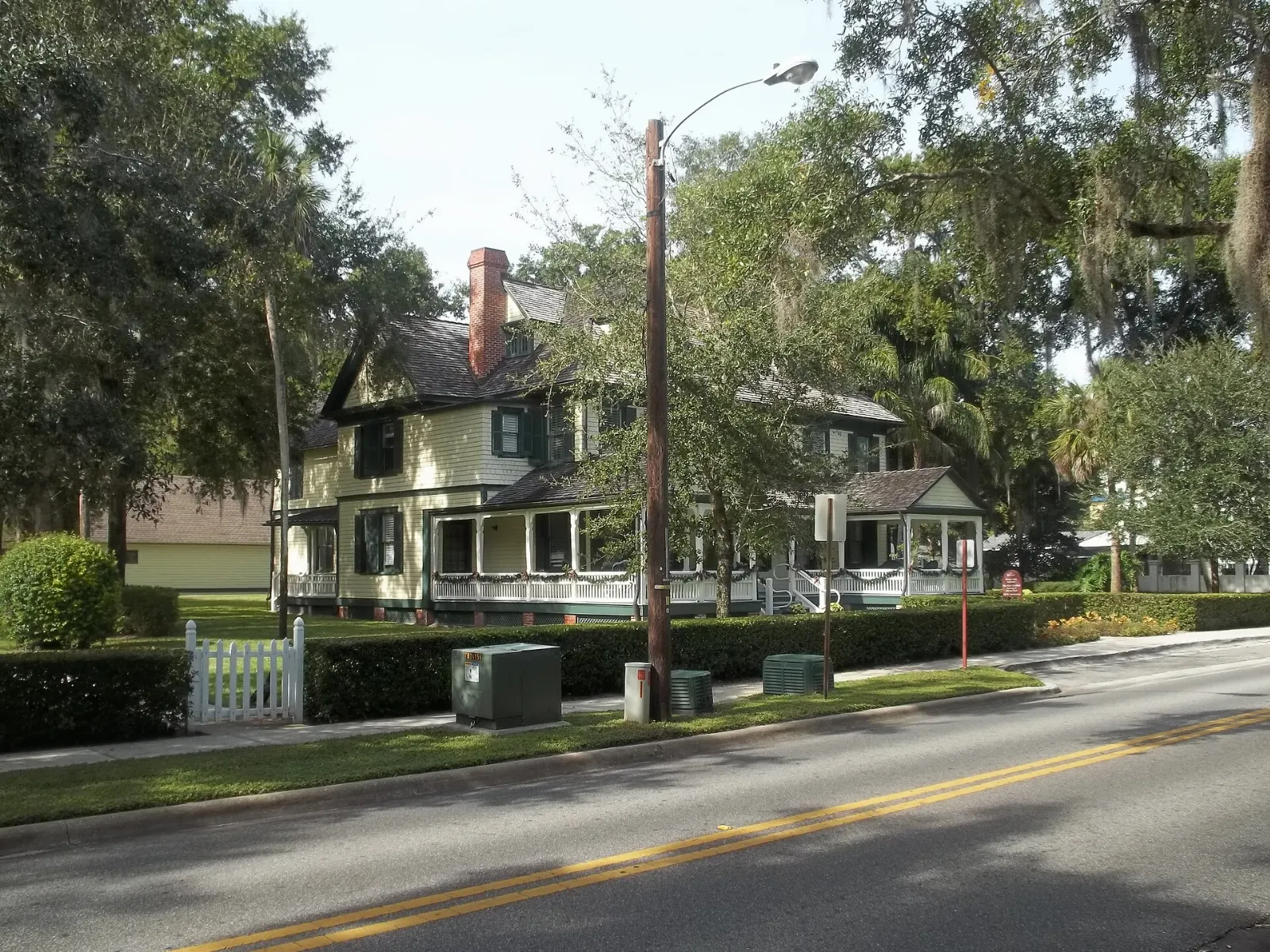 Shops and shaded sidewalks along Park Avenue beside Central Park in Winter Park, Orlando, Florida