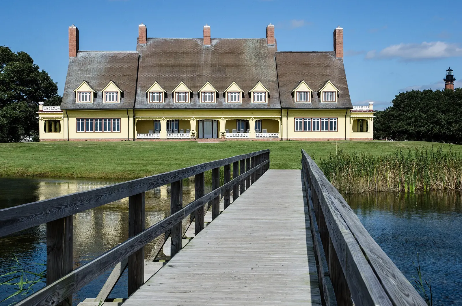 The yellow Whalehead mansion on the shore of Currituck Sound, Outer Banks, North Carolina