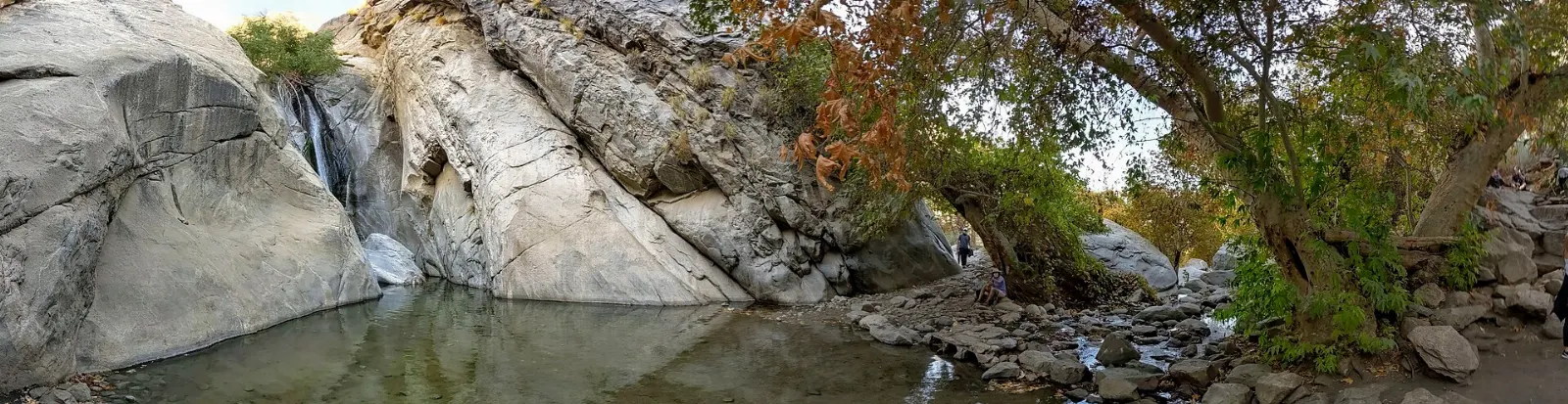 A seasonal waterfall pouring over granite at the back of Tahquitz Canyon, Palm Springs, California