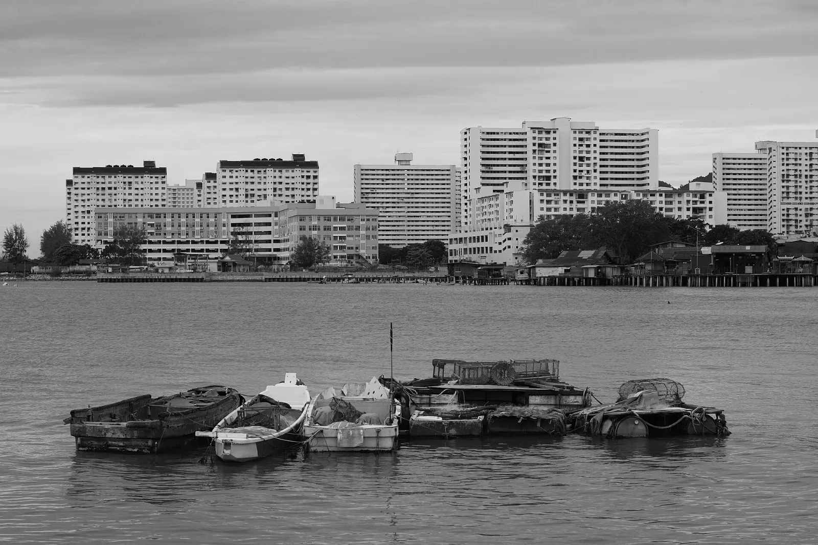 Wooden stilt houses along the boardwalk of Chew Jetty over the water, Penang, Malaysia