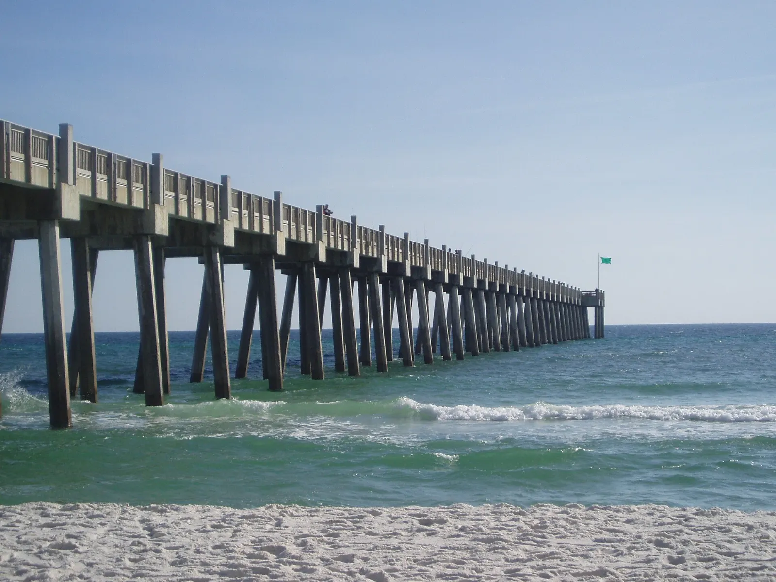 A long fishing pier extending into the Gulf from Pensacola Beach, Florida