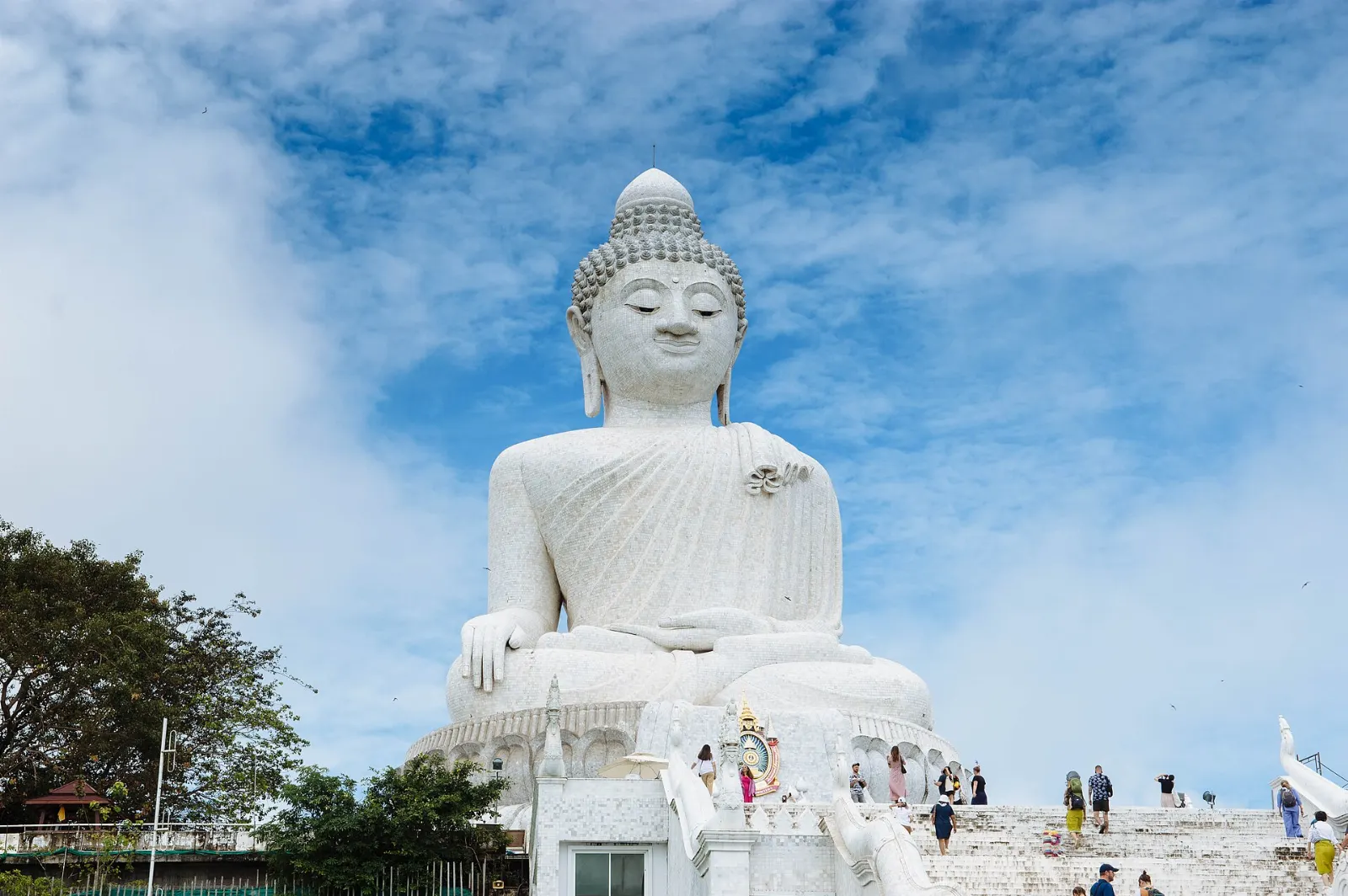 Large white marble seated Buddha statue on the hilltop of Nakkerd Hill, Phuket, Thailand