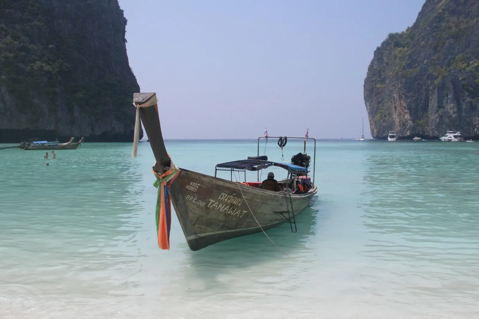Turquoise water and white sand of Maya Bay enclosed by sheer limestone cliffs, Phuket, Thailand
