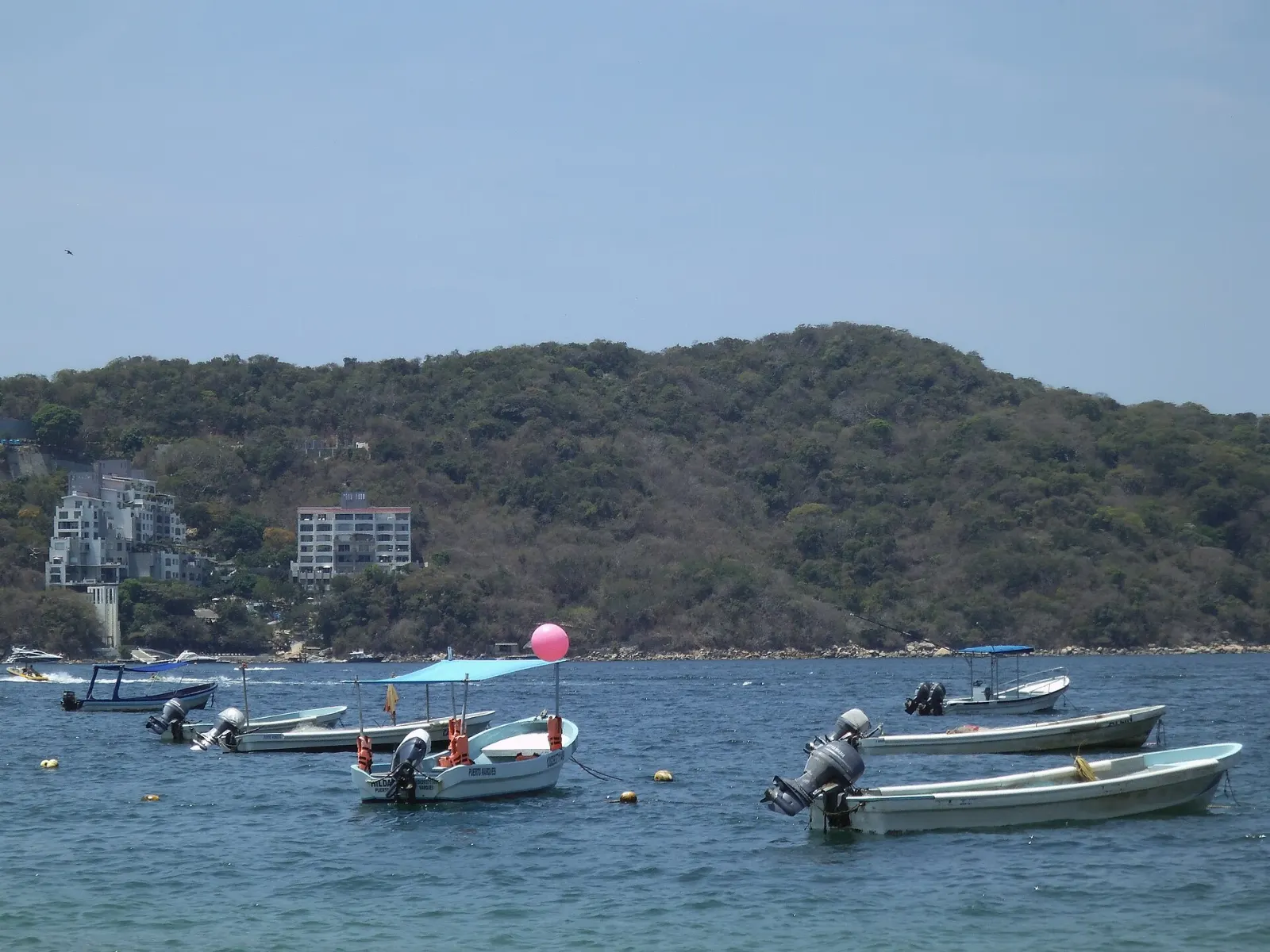 Curved bay and beachfront restaurants at Puerto Marqués, Pie de la Cuesta, Guerrero