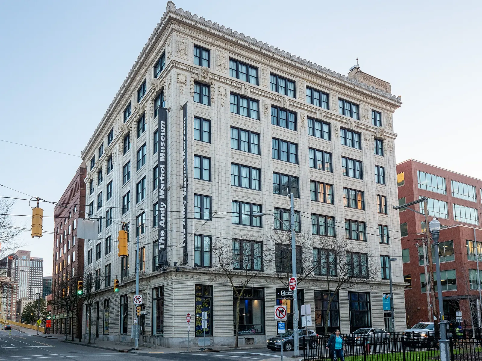 A tall brick museum building with a large banner on the facade, Pittsburgh, Pennsylvania