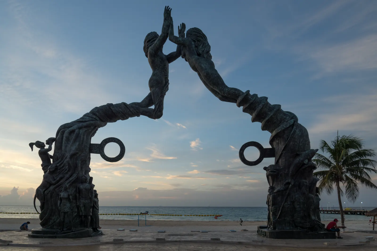 The Portal Maya archway and statue on the beach in Playa del Carmen, Quintana Roo