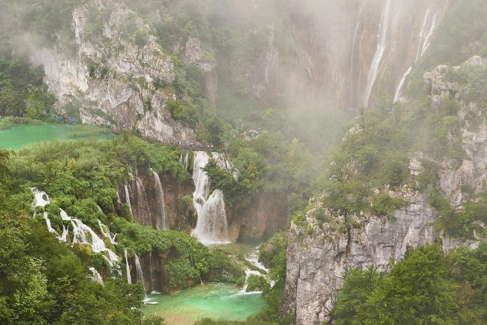 Series of cascades spilling down mossy rock where the lakes drain into the Korana river, Plitvice Lakes National Park, Croatia