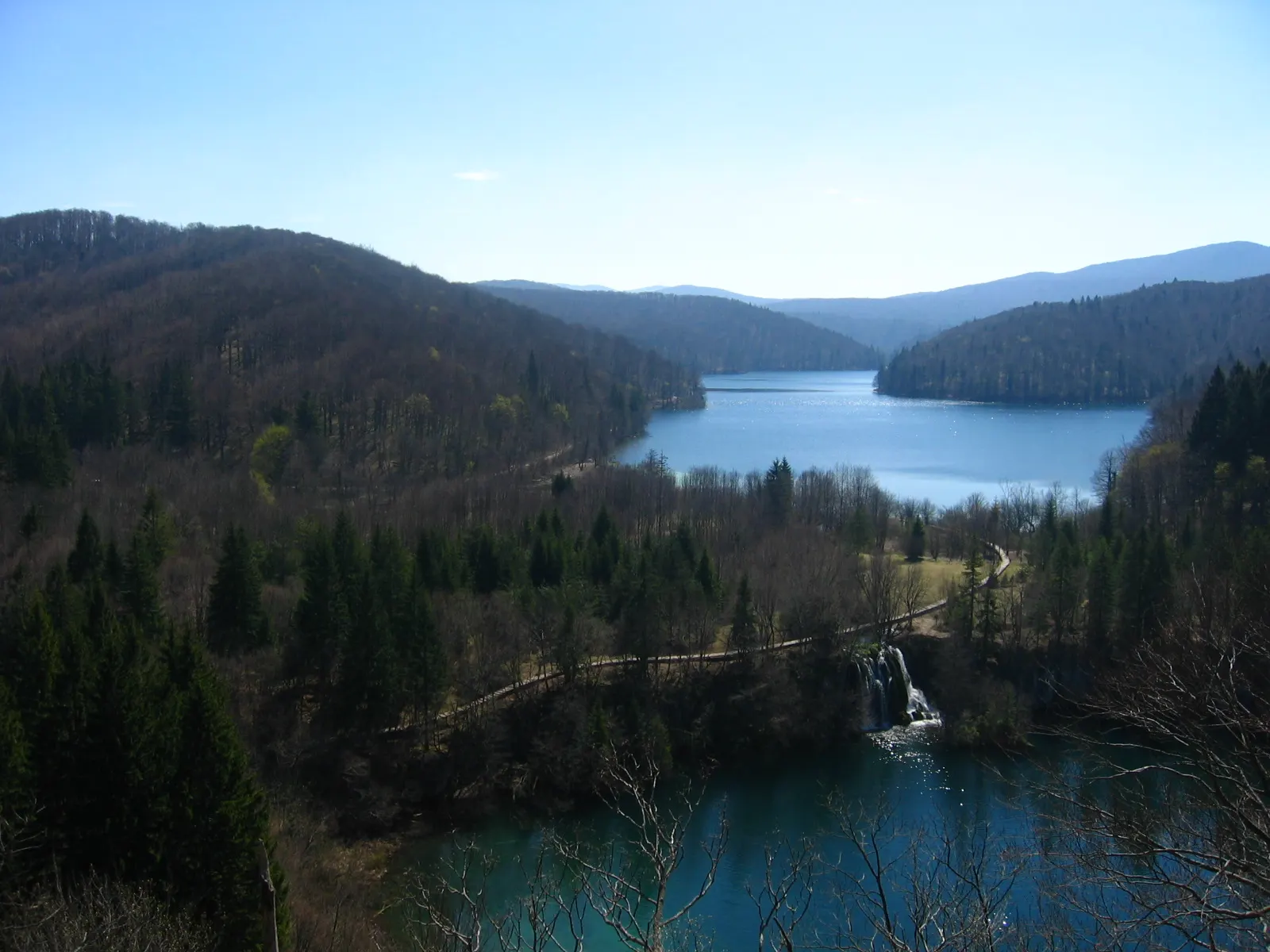 Long calm lake surrounded by forested hills at the top of the Plitvice system, Plitvice Lakes National Park, Croatia