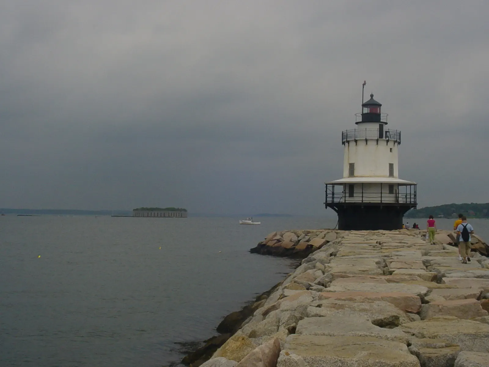 Spark-plug shaped Spring Point Ledge Light at the end of a granite breakwater, Portland, Maine