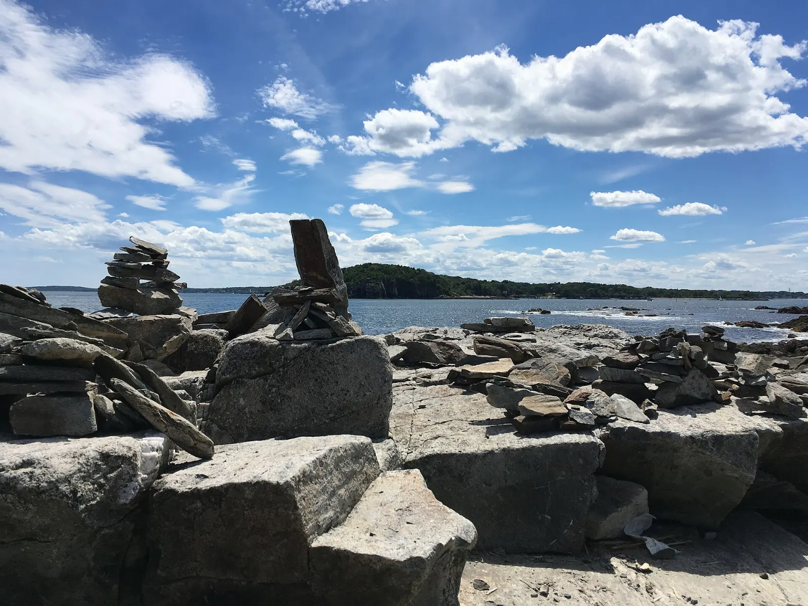 Rocky shoreline and cottages on Peaks Island in Casco Bay, Portland, Maine