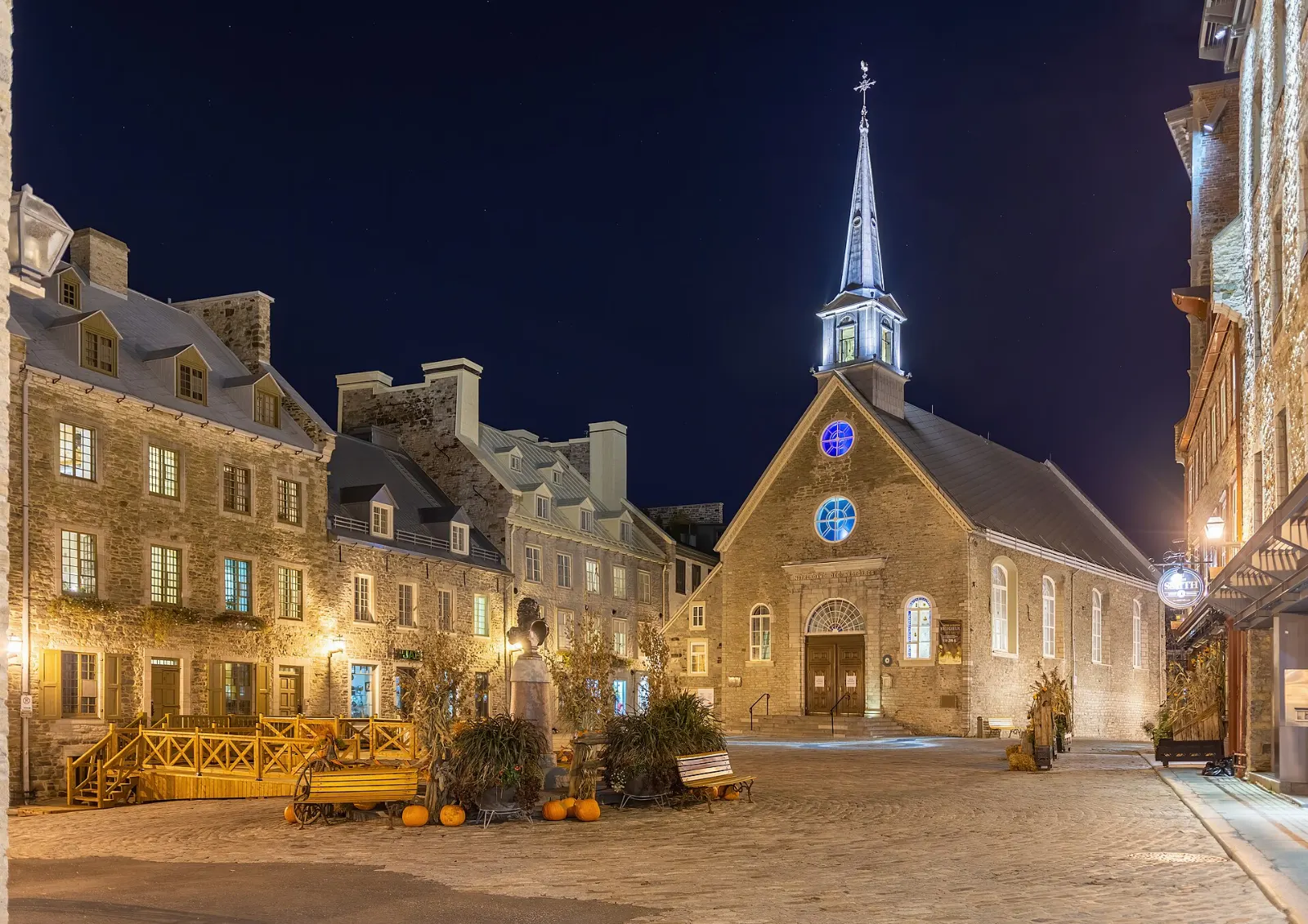 The stone church of Notre-Dame-des-Victoires facing the square at Place Royale, Quebec City, Canada