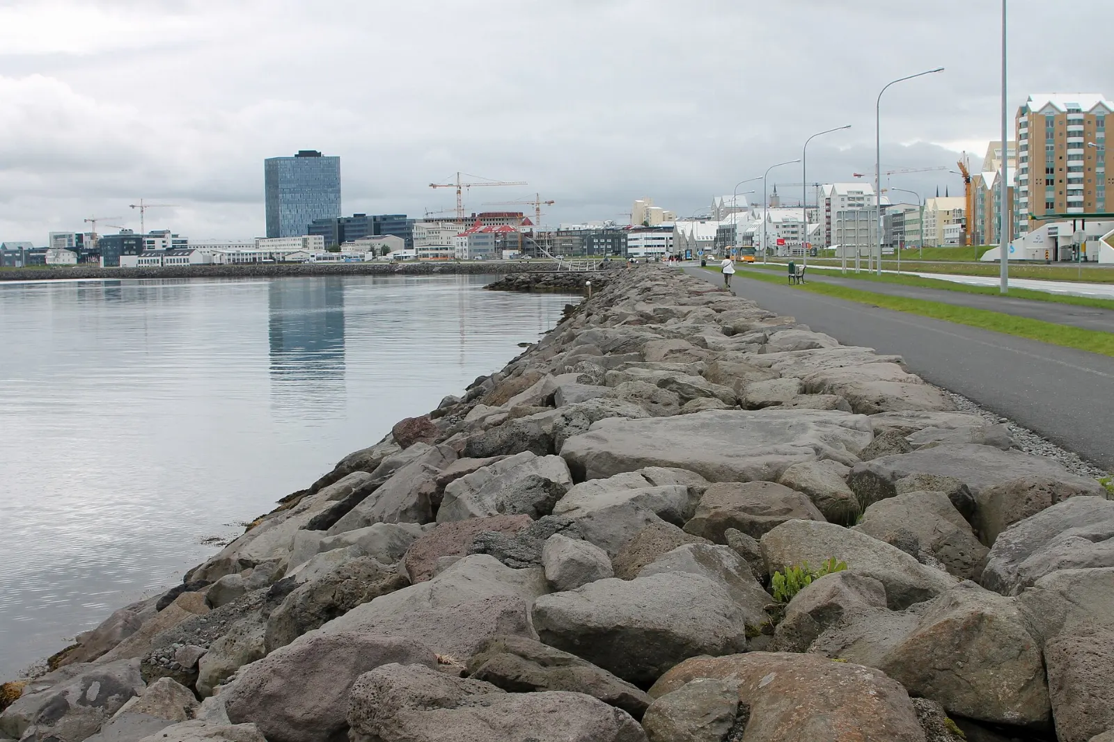 The steel Sun Voyager sculpture shaped like a skeletal ship on the seafront with Mount Esja beyond, Reykjavik, Iceland
