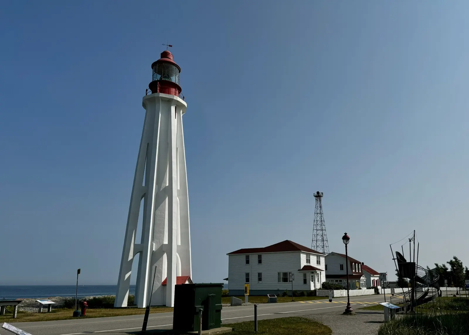 The tall white Pointe-au-Père lighthouse beside the St. Lawrence, Rimouski, Quebec