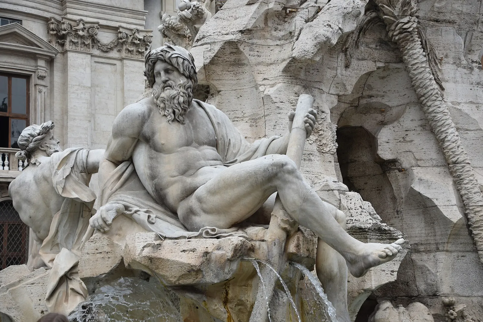 Bernini's Fountain of the Four Rivers with its obelisk in the center of Piazza Navona, Rome, Italy