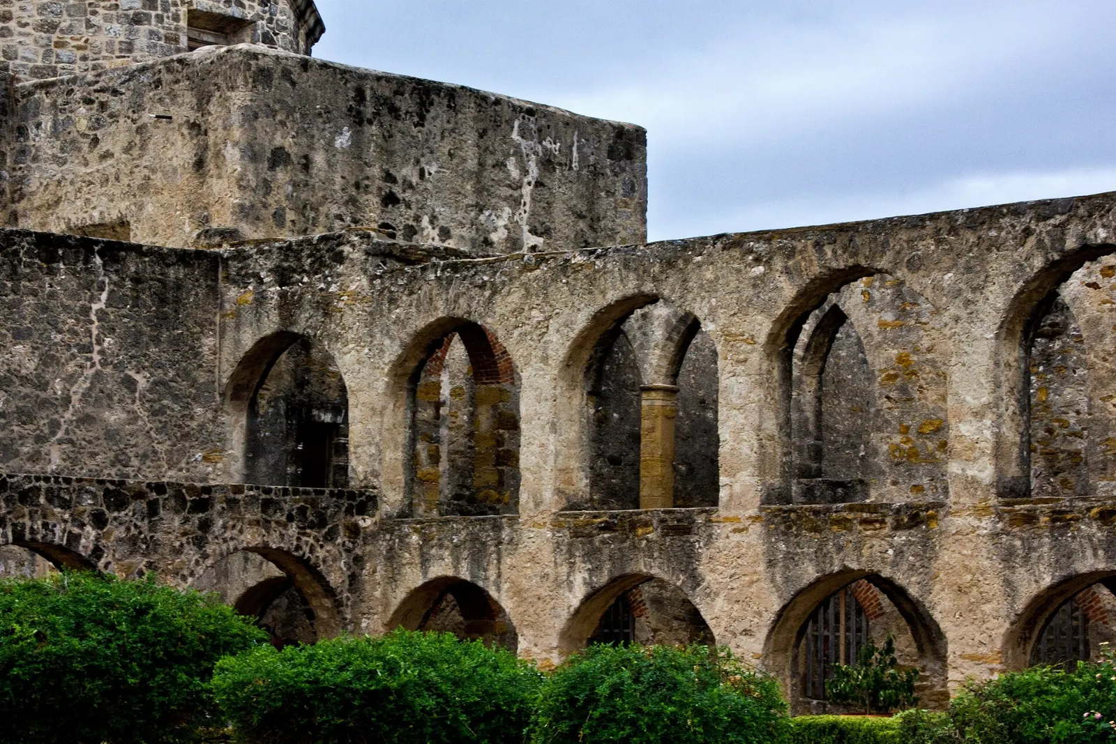 Stone church and carved facade of Mission San Jose with its bell tower, San Antonio, Texas
