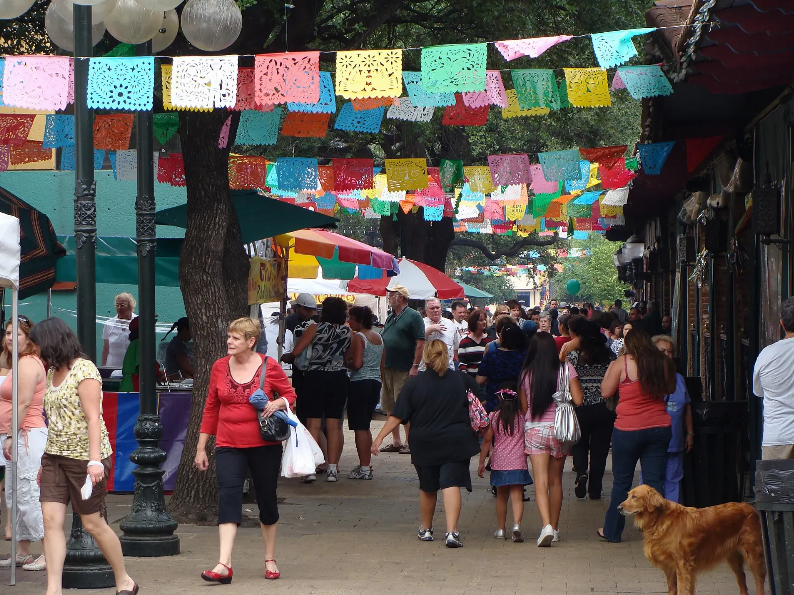 Colorful papel picado banners over the plaza at Market Square, San Antonio, Texas