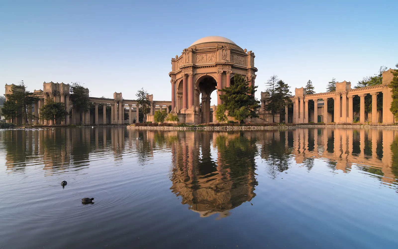 The domed rotunda and colonnades of the Palace of Fine Arts reflected in its lagoon, San Francisco, California