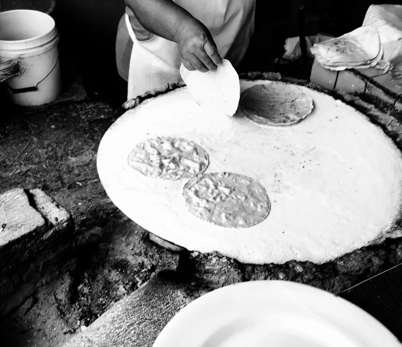 Hand-made tortillas cooking on a clay comal, San José del Pacífico, Oaxaca