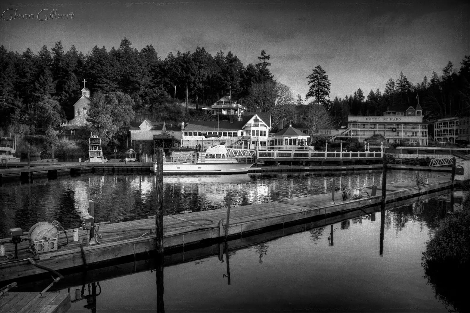 Marina and historic white buildings around the sheltered bay of Roche Harbor, San Juan Islands, Washington