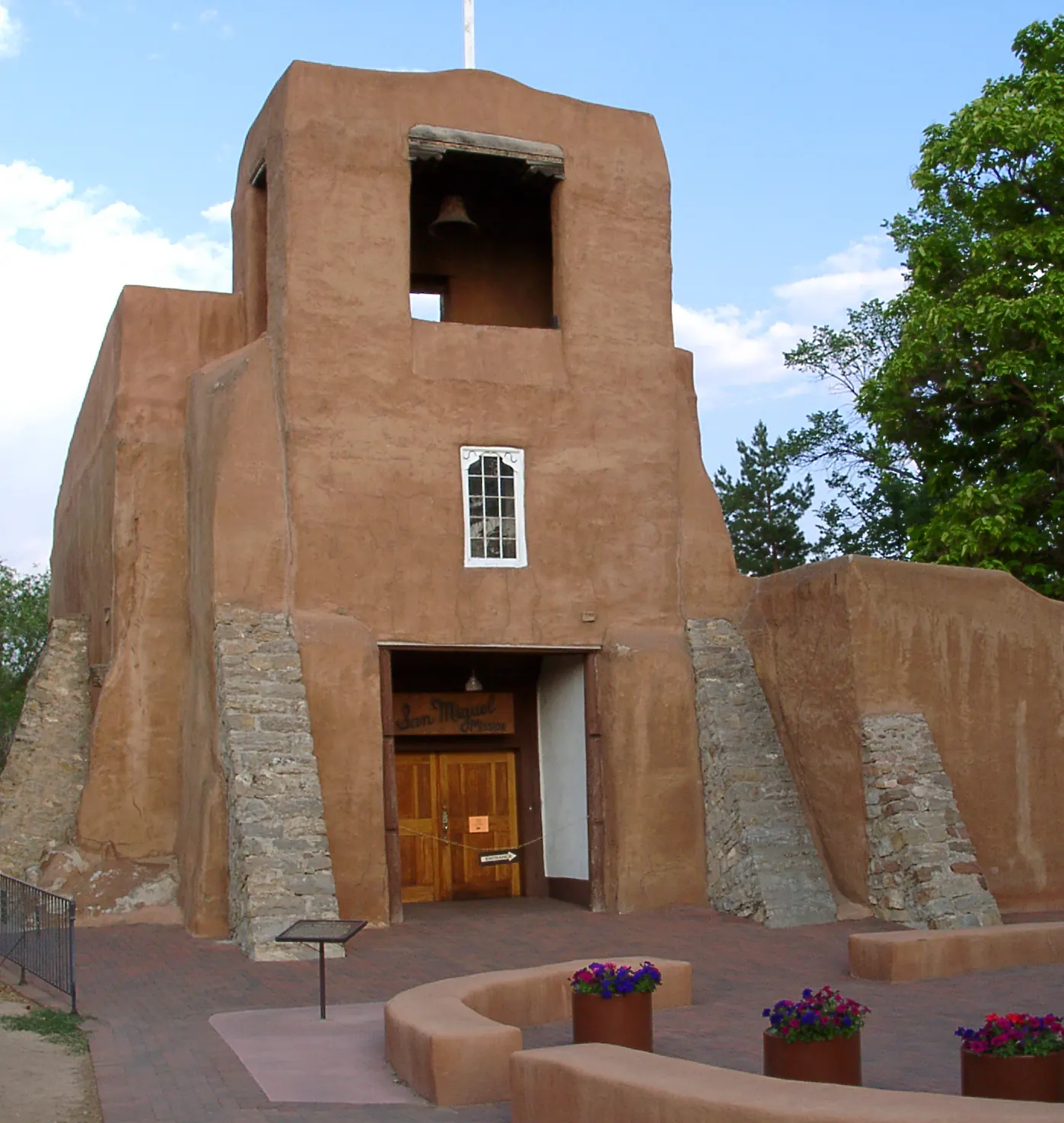 The adobe facade and bell tower of San Miguel Chapel on Old Santa Fe Trail, New Mexico