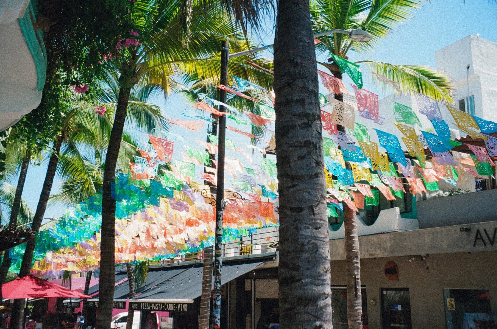 Colorful flags and shops around the plaza in Sayulita, Nayarit
