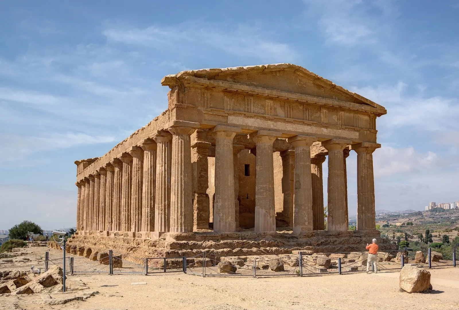 A well-preserved Greek temple with golden stone columns at sunset, Sicily, Italy