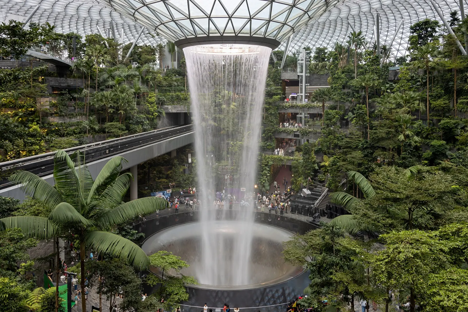 The Rain Vortex waterfall pouring through the glass dome of Jewel Changi Airport, Singapore