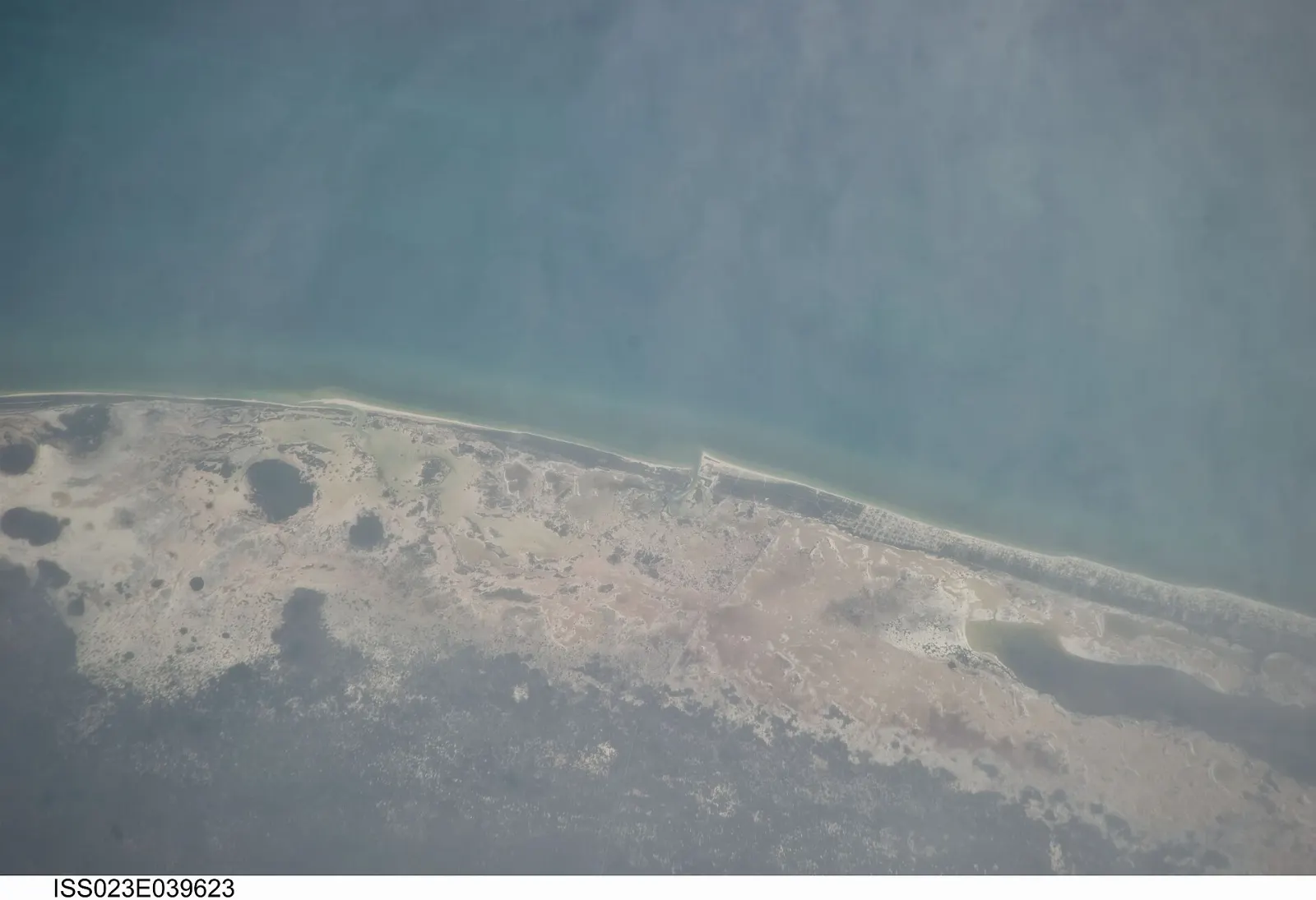 A long sandy beach on the Gulf coast at Sisal, Yucatán