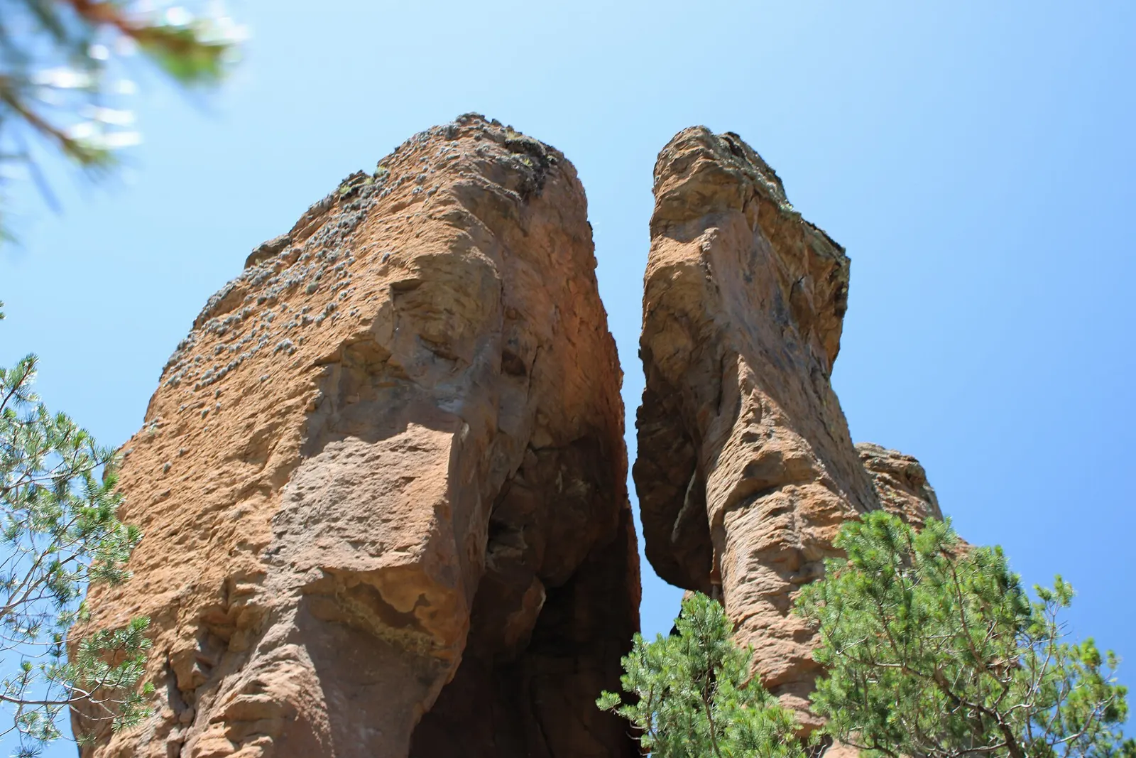 Hikers beneath rock towers in Sierra de Órganos, Sombrerete, Zacatecas