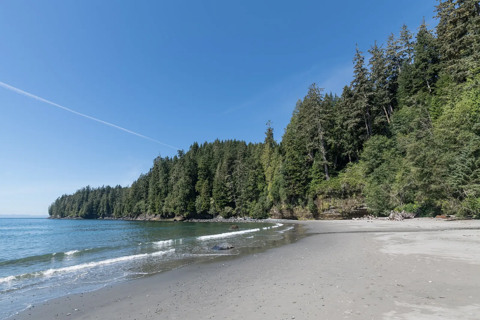 A pebble beach and forest at China Beach near Sooke, British Columbia
