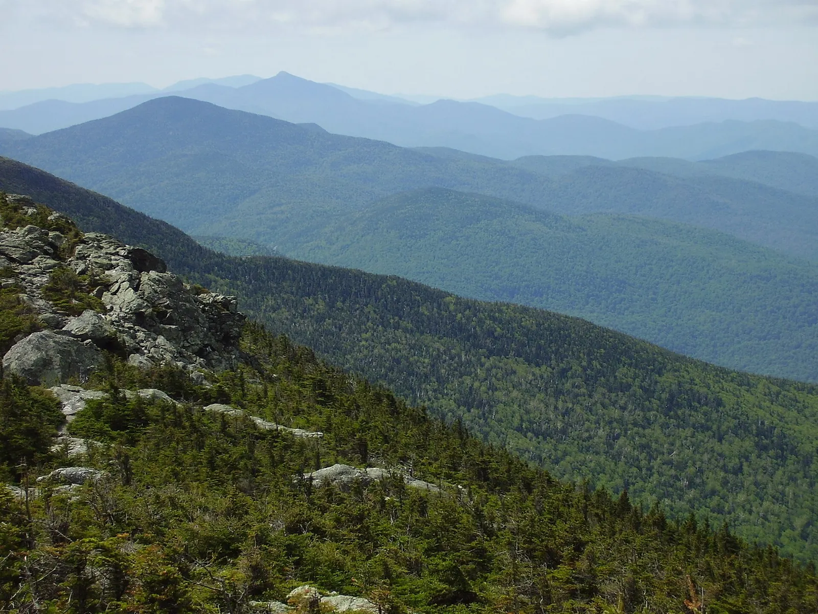 Rocky alpine ridge of Mount Mansfield above forested slopes, Stowe, Vermont