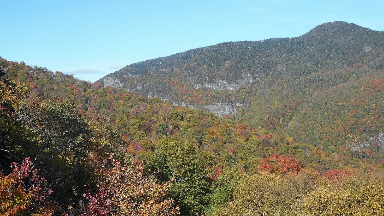 Narrow road winding between huge boulders in Smugglers' Notch, Stowe, Vermont