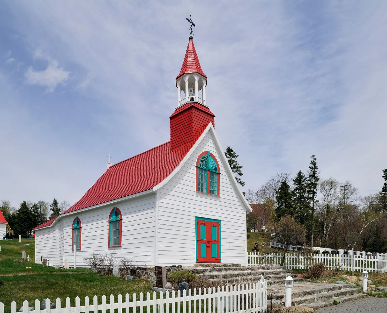 Small wooden Chapelle de Tadoussac with a red roof, Quebec