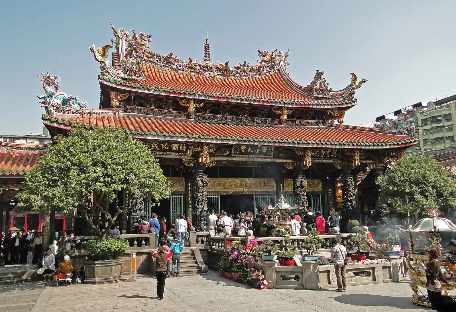 Ornate roof ridges and carved dragons at Longshan Temple in Wanhua, Taipei, Taiwan