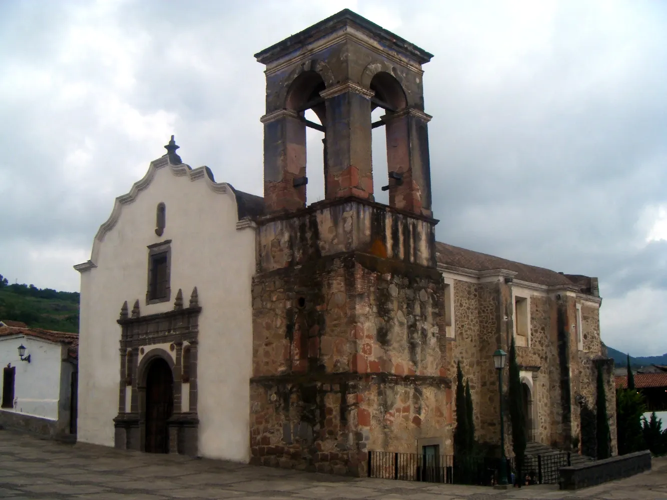 White Templo La Merced with its tall bell tower in Tapalpa, Jalisco