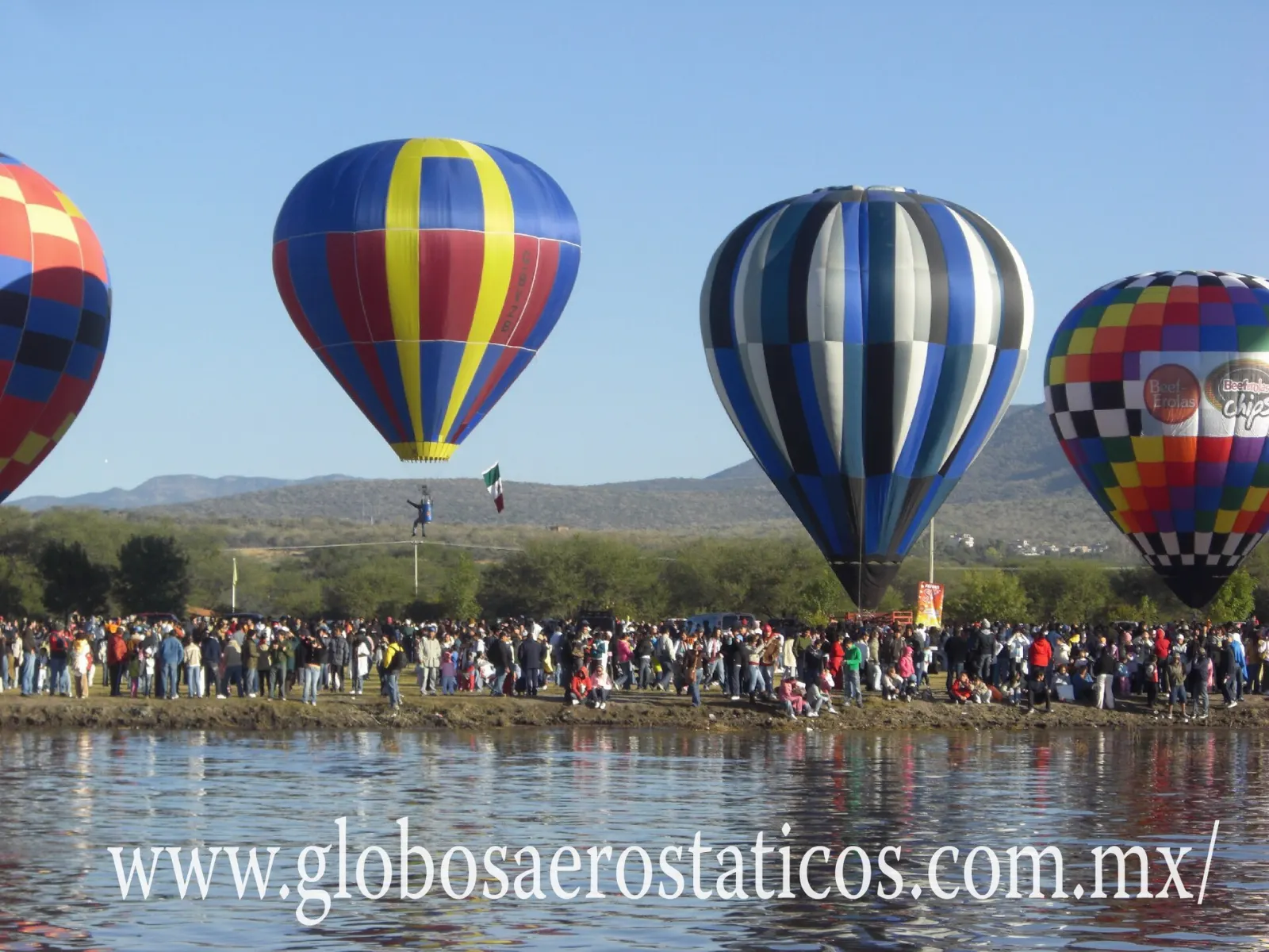 Hot air balloons floating above the pyramids of Teotihuacan at sunrise, State of Mexico