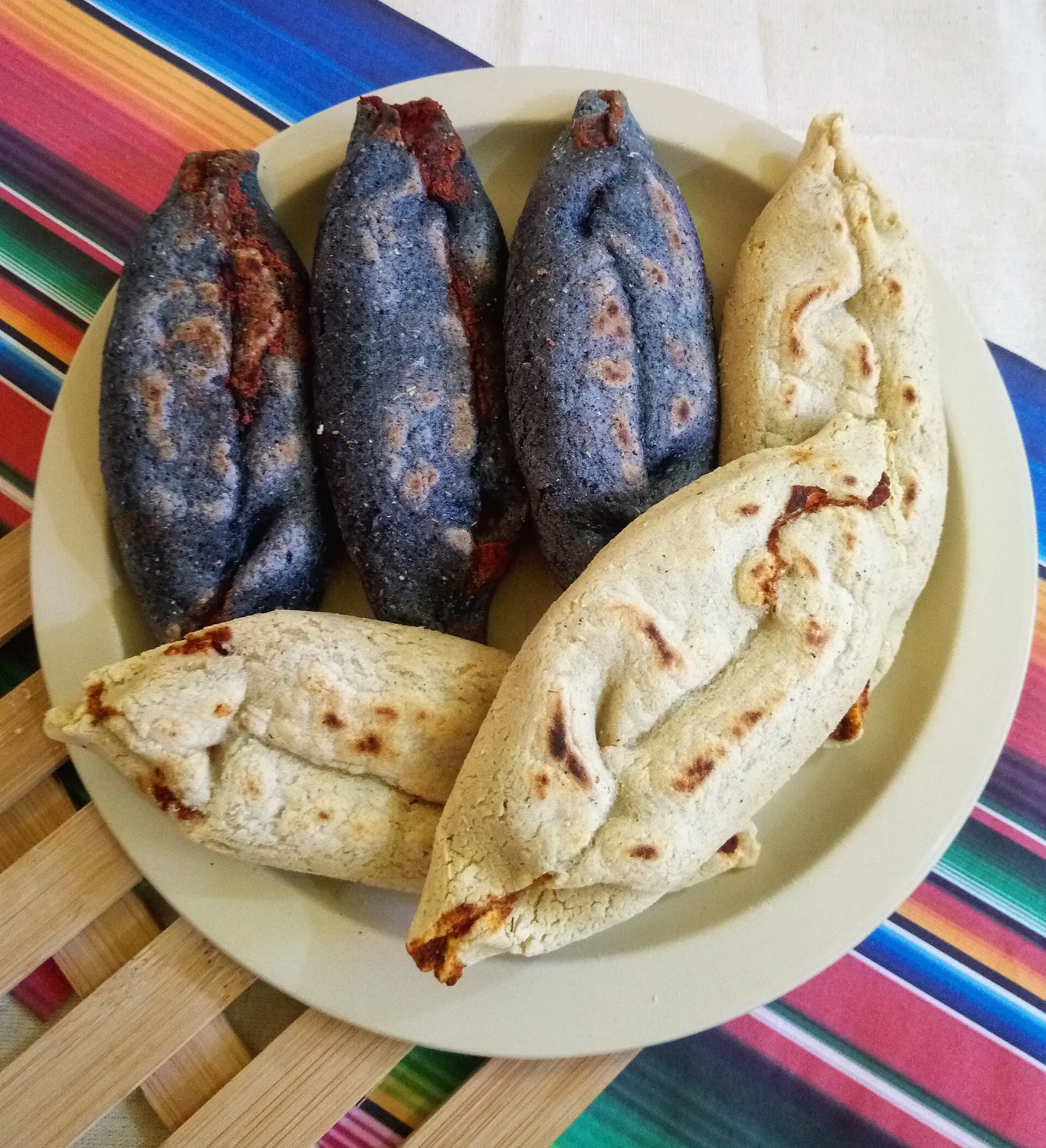 Tlacoyos stuffed with beans and topped with nopal on a market stall, Teotihuacan, State of Mexico
