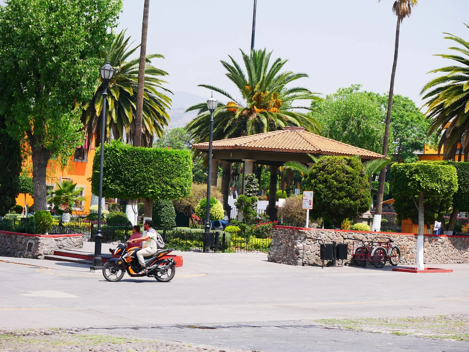 Plaza with arcades and trees in front of the church in Tepotzotlán, State of Mexico