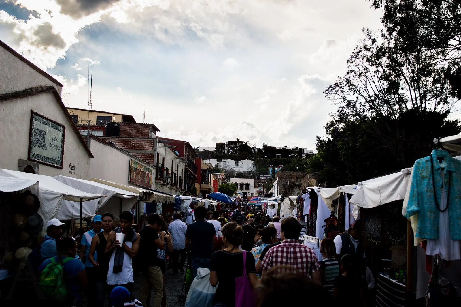 Stalls of crafts and food in a street market in Tepotzotlán, State of Mexico