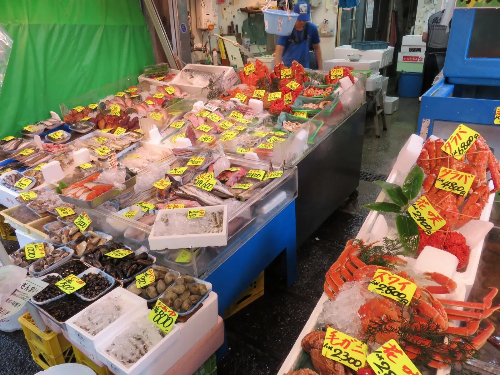 Busy market street with seafood and food stalls, Tokyo, Japan